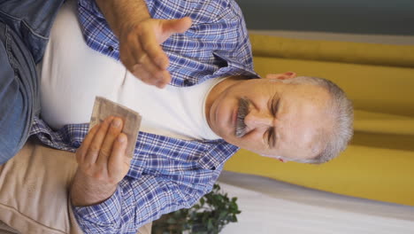 Vertical-video-of-Angry-old-man-with-high-bill.